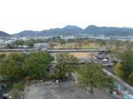 To the expansive, now empty west yards of the castle. The cityscape ends pretty quickly that way. Even the mountains here are different, more round and distinct than the long ridges of Kansai.